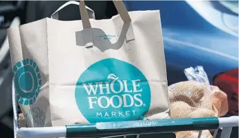 ?? AP FILE ?? Amazon Prime members in Florida will get discounts at Whole Foods Market with new benefits introduced on Tuesday.
