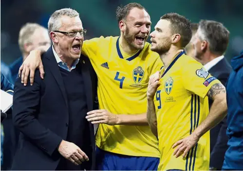  ??  ?? Joy all round: Sweden coach Janne Andersson (left) celebratin­g with captain Andreas Granqvist and Marcus Berg at the end of the World Cup playoff second-leg match at the San Siro in Milan on Monday. — AP