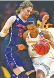  ?? THE ASSOCIATED PRESS ?? Tennessee forward Jaime Nared, right, collides with Liberty’s Ola Makurat during the first half of their NCAA tournament game Friday afternoon in Knoxville.