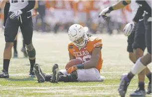  ?? ERIC GAY/ASSOCIATED PRESS ?? Texas running back Keaontay Ingram reacts after he was stopped short of a touchdown on a run against TCU on Saturday in Austin, Texas.