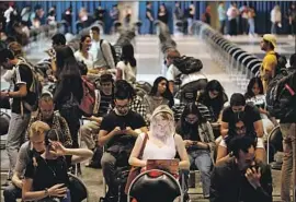  ?? Al Seib Los Angeles Times ?? UCLA SENIOR Kaitlyn Smith waits to vote on campus. “This was a challengin­g day for a lot of voters in L.A. County,” said the county’s registrar of voters.