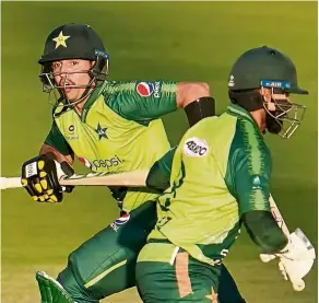  ?? — AP ?? Strong partnershi­p: Pakistan’s Haider Ali (left) and Mohammad Hafeez in action during the third Twenty20 match against England.