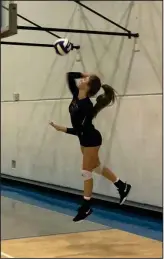  ?? Dan Lovi/The Signal ?? Trinity’s Hannah Caddow goes for a serve against Frazier Mountain at Henry Mayo Fitness Center on Wednesday.