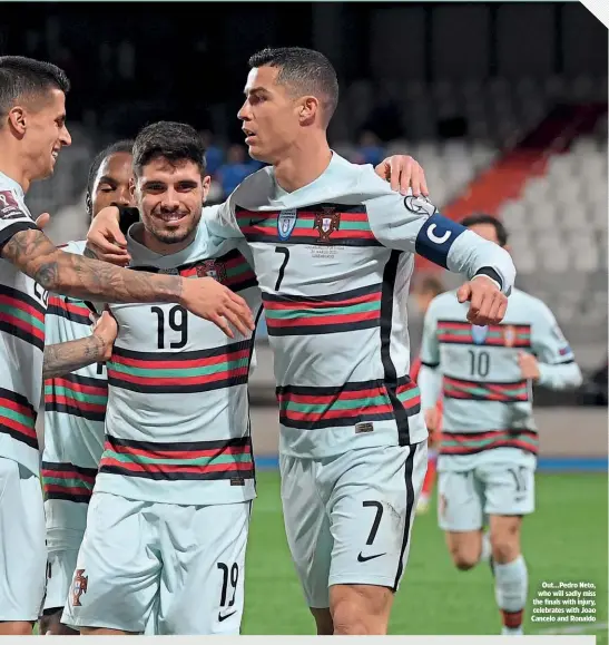  ??  ?? Out…Pedro Neto, who will sadly miss the finals with injury, celebrates with Joao Cancelo and Ronaldo