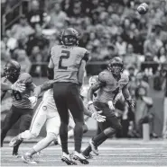  ?? THE ASSOCIATED PRESS ?? Syracuse running back Dontae Strickland, right, prepares to catch a touchdown pass from Eric Dungey on Friday against Clemson in Syracuse, N.Y.