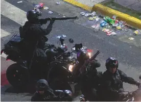  ??  ?? River party...police in Buenos Aires try to disperse fans