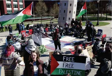  ?? Jim Michaud/Hearst Connecticu­t Media ?? UConn students protest the Hamas-Israel war on Friday on the UConn Campus in Storrs.