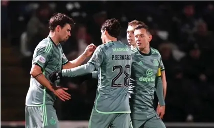  ?? Photograph: Jane Barlow/PA ?? Matt O'Riley (left) celebrates scoring Celtic’s second goal at St Mirren in the sixth minute of the match.