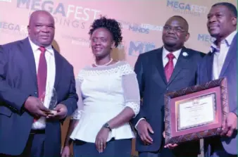  ??  ?? Mr Worthwhile Mugabe (left) of DSK Electrical was voted the Megafest Industrial­ist of the Year 2016, next to him is the guest of honour Mrs Nomathemba Ndlovu of ZITF while the CEO of Megafest Dr Tafadzwa Matsika and an official from DSK electrical hold...
