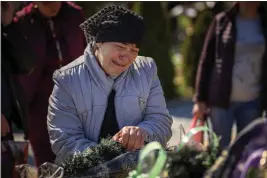  ?? EMILIO MORENATTI — THE ASSOCIATED PRESS FILE ?? The mother of Oleksandr Mozheiko, 31, an Irpin Territoria­l Defense soldier killed by the Russian army, cries at his grave at the cemetery of Irpin on the outskirts of Kyiv.