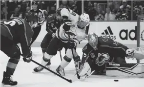  ?? RON CHENOY/USA TODAY SPORTS ?? Lightning left wing Ondrej Palat moves in for a shot against Colorado Avalanche defenseman Cale Makar, left, and goaltender Darcy Kuemper on Friday in Game 5 of the Stanley Cup Final.