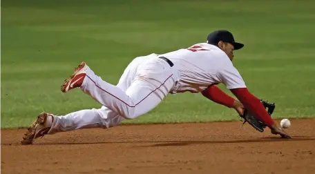  ?? STuART CAHiLL pHOTOs / HeRALd sTAFF ?? DIAMOND DUDS: Red Sox third baseman Rafael Devers can’t make a play on a Luke Voit grounder during Saturday’s game against the Yankees. Left fielder Michael Chavis (top right) lets a Rio Ruiz flyball get over his head against the Orioles on Tuesday night.