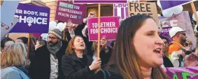  ?? Picture: SAEED KHAN/AFP ?? SO MUCH FOR SISTERHOOD: Pro-abortion protesters don’t seem bothered by the amendment for gender-selection abortion.