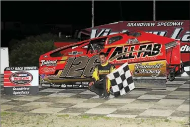  ?? RICK KEPNER - FOR DIGITAL FIRST MEDIA ?? Jeff Strunk poses in victory lane after his win at Grandview Speedway on June 3.