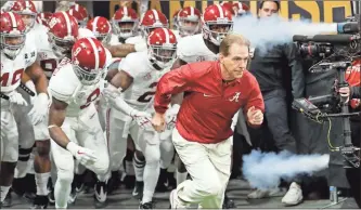  ?? / AP-David Goldman, File ?? Alabama head coach Nick Saban leads his team on the field before the NCAA college football playoff championsh­ip game against Georgia in Atlanta. The AP preseason Top 25 is out, for the third straight year Alabama is No. 1.