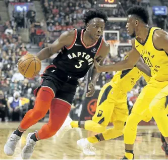  ?? JACK BOLAND/POSTMEDIA NETWORK ?? Toronto Raptors’ forward OG Anunoby drives against Indiana Pacers’ power forward Thaddeus Young during a game in Toronto, on Dec. 2, 2017.