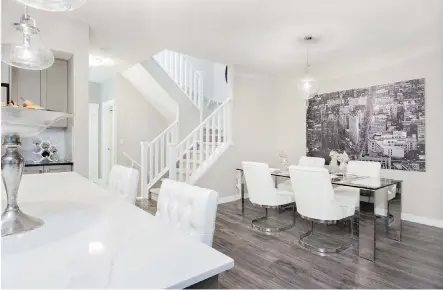  ?? PHOTOS: SHANE HOMES ?? The main floor in the Ladera by Shane Homes is spacious, with the staircase opening to the kitchen and seating area.