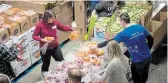  ?? TORSTAR FILE PHOTO ?? Volunteers pack hampers at The Food Bank of Waterloo Region.