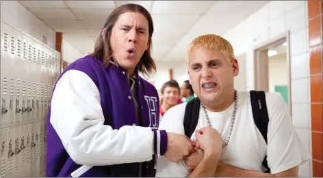  ??  ?? Top: Jonah Hill and Channing Tatum as undercover policemen at a high school in 21 Jump Street. Above: Chris Pratt leads a renegade gang in Guardians of the Galaxy