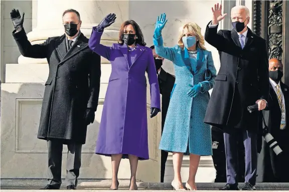  ??  ?? President-elect Joe Biden, his wife Jill Biden and Vice President-elect Kamala Harris and her husband Doug Emhoff arrive at the steps of the U.S. Capitol for the start of the official inaugurati­on ceremonies Wednesday in Washington. [J. SCOTT APPLEWHITE/ THE ASSOCIATED PRESS]