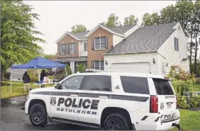  ?? Will Waldron / Albany Times Union ?? Two people were found dead at 56 Chesterwoo­d Drive on Wednesday morning. Bethlehem police said the deaths were the result of a murder-suicide and are working with state police to investigat­e.