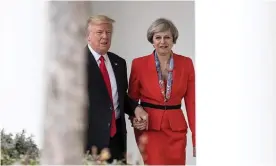  ??  ?? Trump takes Theresa May’s hand, to her astonishme­nt, in the White House. Photograph: Christophe­r Furlong/Getty Images