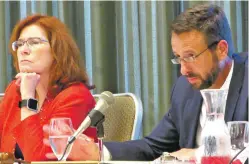  ?? WILL WEBBER/THE NEW MEXICAN ?? University of New Mexico President Garnett Stokes and Robert Doughty, president of the board of regents, listen to public comments during Friday’s meeting to consider cutting sports.