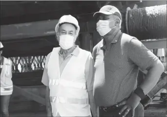  ??  ?? From right are Minister of Home Affairs, Robeson Benn and Ret’d Specialist in Bridges and Designs, Joseph Holder (Ministry of Public Works photo)