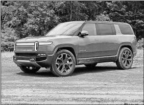  ?? EDMUNDS VIA AP ?? The 2023 Rivian R1S all-electric SUV has four motors cranking out 835 horsepower.