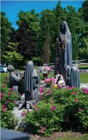  ??  ?? In the Portuguese section of Beechwood Cemetery there is a statue of Our Lady of Fátima. Rosaries are draped on the Virgin Mary’s wrists for her blessing.