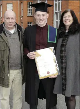  ??  ?? Alex Brophy from Tiglin, who earned his Level 6 Certificat­e in Business, with Paul Healy and Mary White.