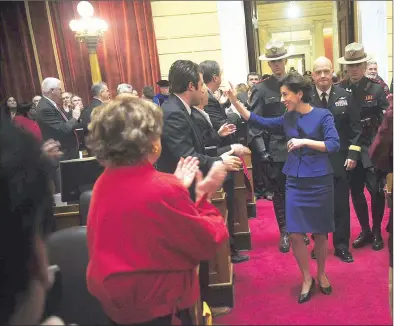  ?? Ernest A. Brown/The Call ?? Governor Gina Raimondo acknowledg­es supporters as she enters the House chamber for her State of the State Address before a joint session of the General Assembly Tuesday night. Raimondo unveiled plans for a $9 billion budget, which includes her...
