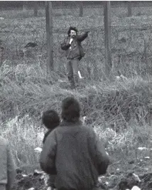  ??  ?? Michael Stone fires on mourners following his grenade attack on an IRA funeral at Milltown Cemetery in March 1988. The loyalist killer has been told he must remain in prison until 2024