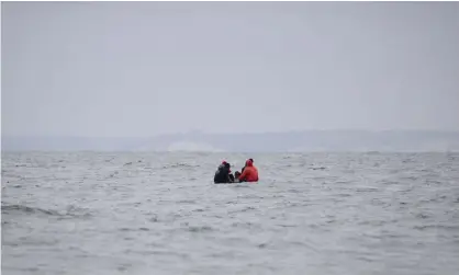  ?? Photograph: Sameer Al-Doumy/AFP/Getty Images ?? Migrants on a boat in the Channel in August. The total number of asylum applicatio­ns received by the UK between April and June nearly halved compared with the first three months of the year.