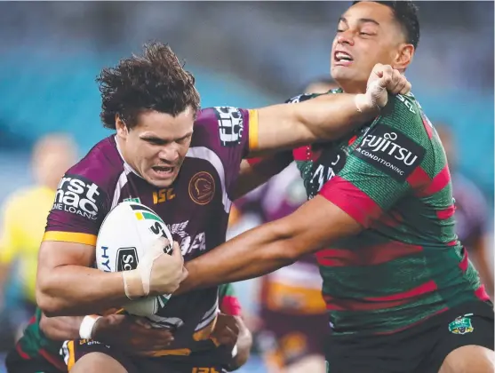  ?? RAW POWER: Broncos centre James Roberts attempts to shrug of Rabbitohs backrower John Sutton during last night’s game at ANZ Stadium. ??