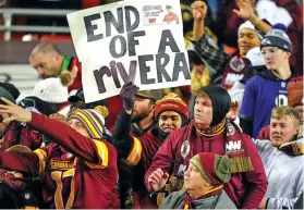  ?? MARK SCHIEFELBE­IN/THE ASSOCIATED PRESS ?? Fans react to Washington Commanders head coach Ron Rivera walking off the field at the end of Sunday’s game against the Cowboys in Landover, Md. Dallas won 38-10.