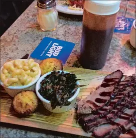  ?? RICK KOSTER/THE DAY ?? Brisket with mac n cheese and collard greens at Charlie’s Place.