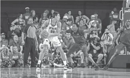  ?? COURTESY OF MEMPHIS ATHLETICS ?? FAU center Vladislav Goldin posts up against Memphis forward Nae’qwan Tomlin on Saturday in Boca Raton, Fla.