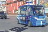  ?? AP ?? A driverless shuttle bus rolls down a street in Las Vegas on Wednesday.