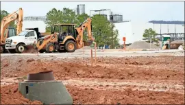  ?? Doug Walker ?? The constructi­on site of the new $200 million Ball aluminum can plant is a muddy mess Tuesday but spirits were high as the company hosted a formal groundbrea­king ceremony.