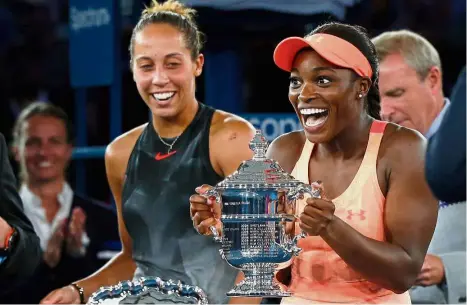  ?? — Reuters ?? Is this for real?: Sloane Stephens reacting after receiving the US Open trophy after defeating Madison Keys (left) 6-3, 6- 0 in the final.