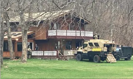  ?? PROVIDED BY ULSTER COUNTY SHERRIFF’S OFFICE ?? The Ulster County Sheriff’s Office armored vehicle is parked outside the house on Creek Side Drive in Shandaken, N.Y., on Sunday, April 11.