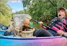  ?? ?? The winner of the $500 first-place prize in the adult category is Richard Oberndorf of Franklin Park. His “Teach Your Babies to Respect Our Waterways!” shows a baby doll and other items pulled from Loyalhanna Creek.