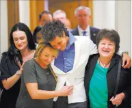  ?? Mark Makela ?? The Associated Press Bill Cosby accuser Andrea Constand, center, and supporters embrace Thursday after Cosby’s conviction at the Montgomery County Courthouse in Norristown, Pa.