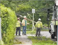  ?? Matthew Brown / Hearst Connecticu­t Media ?? Utility crews work on a broken utility pole in Stamford as they repair damage left by Tropical Storm Isaias.