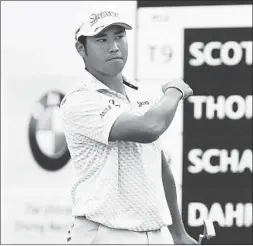  ?? JOE LEWNARD/AP ?? Hideki Matsuyama celebrates after sinking a 30-foot birdie putt to close out his second round at the BMW Championsh­ip. He broke the Medinah course record with a 63.