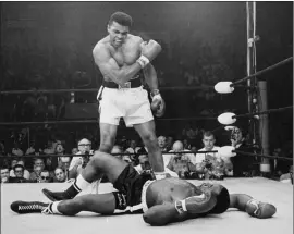  ??  ?? In this May 25, 1965, file photo, heavyweigh­t champion Muhammad Ali, then known as Cassius Clay, stands over challenger Sonny Liston, shouting and gesturing shortly after dropping Liston with a short hard right to the jaw, in Lewiston, Maine.