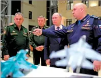  ?? AP PHOTO ?? Russian President Vladimir Putin, second right, Russian Defense Minister Sergey Shoigu, left, and Chief of the General Staff of the Russian Armed Forces Valery Gerasimov, second left, listen to Commander of the Russian Aerospace Force Sergei Surovkin,...