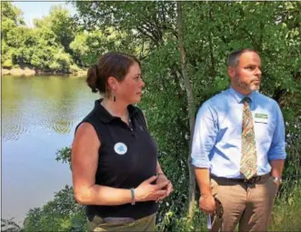  ?? GLENN GRIFFITH -- GGRIFFITH@DIGITALFIR­STMEDIA.COM ?? DEC Chief of Staff Julie Tighe and Justin Perry, the chief of the Bureau of Invasive Species and Ecological System Health, Division of Land and Forest with the Department of Environmen­tal Conservati­on, discuss the finer points of early detection campaigns as part of Invasive Species Week.