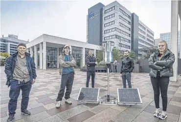  ?? ?? ↑ Dr Andrew Cowell. left, with and student engineers and the flatpack wind turbine